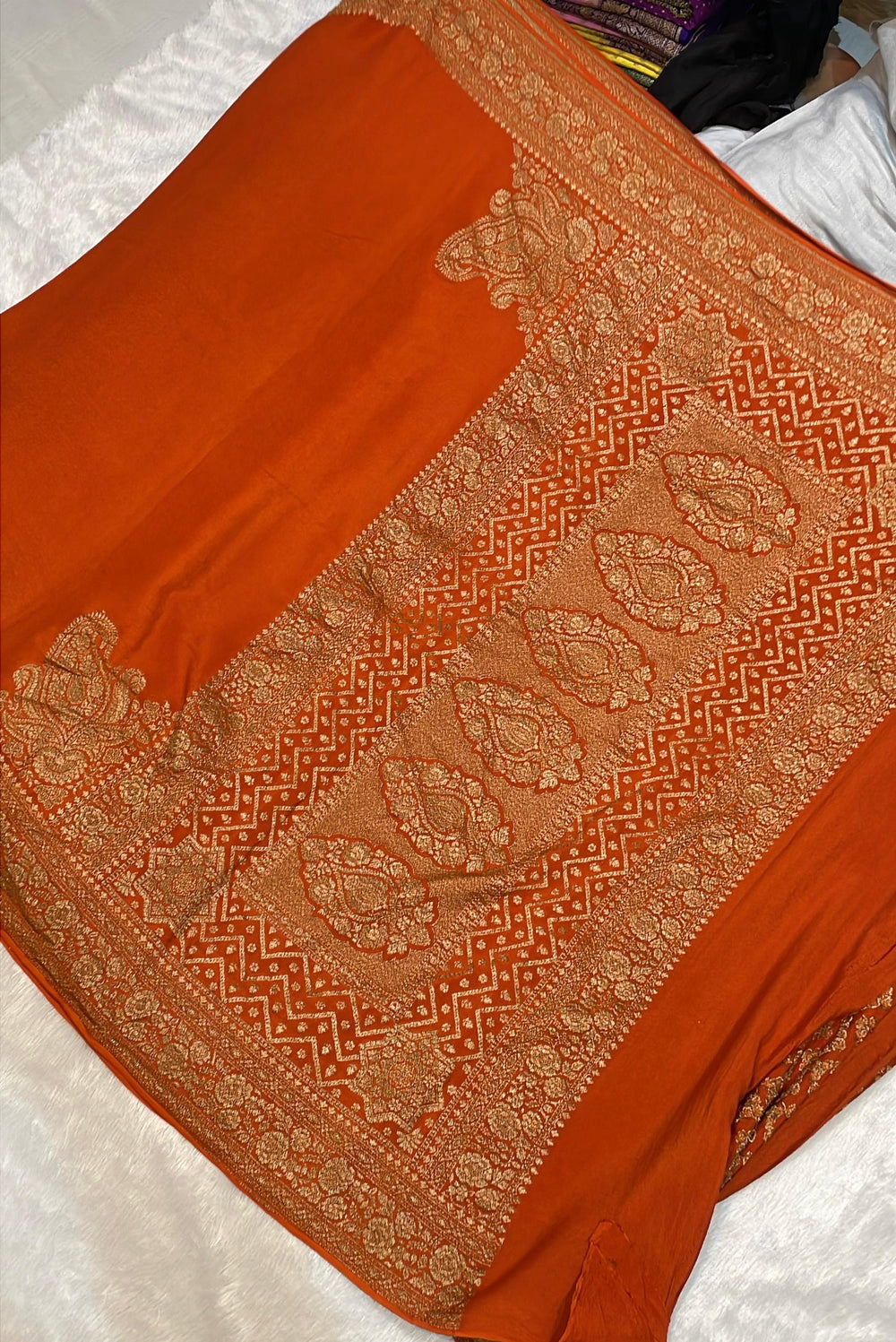 Pure Banarasi Khaddi Crape Silk Handloom Saree with Traditional Corners Rust Orange Color