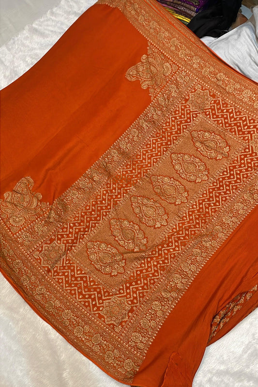 Pure Banarasi Khaddi Crape Silk Handloom Saree with Traditional Corners Rust Orange Color