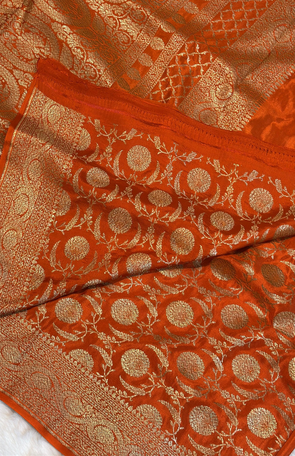 Pure Banarasi Khaddi Crape Silk Handloom Saree with Traditional Corners Rust Orange Color