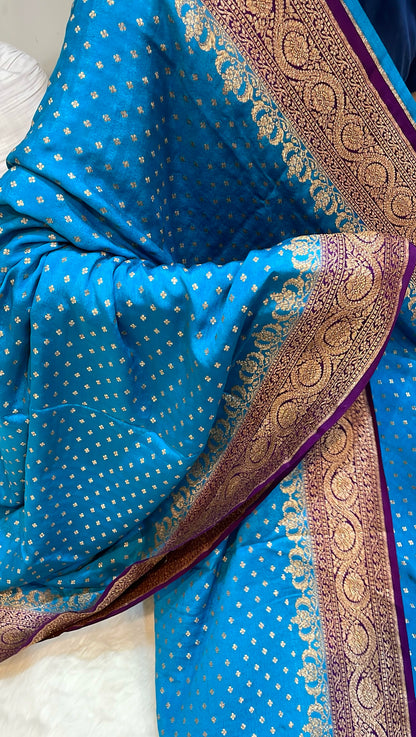 Pure Banarasi Khaddi Crape Silk Handloom Saree with Traditional Corners Firozi with Purple color