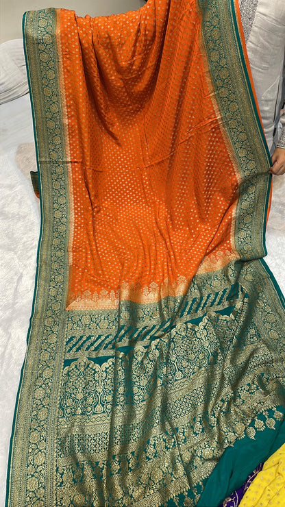 Pure Banarasi Khaddi Crape Silk Handloom Saree with Traditional Corners Orange With Green