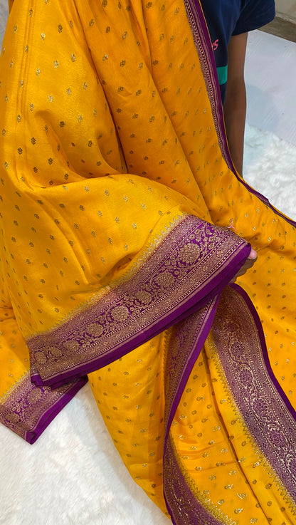 Pure Banarasi Khaddi Crape Silk Handloom Saree with Traditional Corners Yellow With Purple Color
